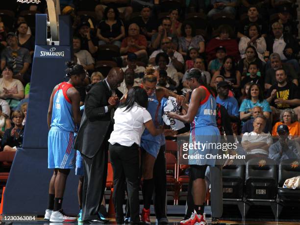 Erika de Souza of the Atlanta Dream is injured during the game against the Connecticut Sun on June 14, 2015 at Mohegan Sun Arena in Uncasville,...