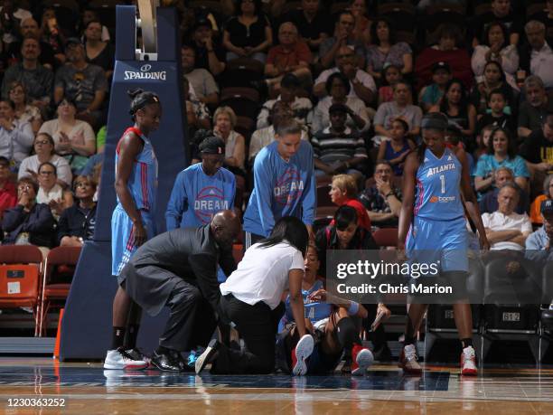 Erika de Souza of the Atlanta Dream is injured during the game against the Connecticut Sun on June 14, 2015 at Mohegan Sun Arena in Uncasville,...