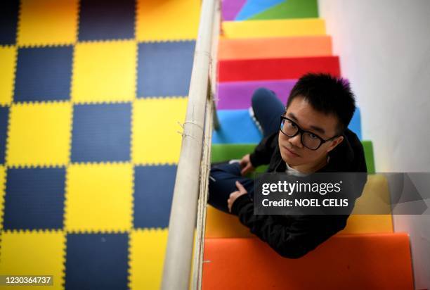 This photo taken on November 27, 2020 shows Matthew, who requested use of his first name only and runs the NGO Chengdu Rainbow, at the office in...