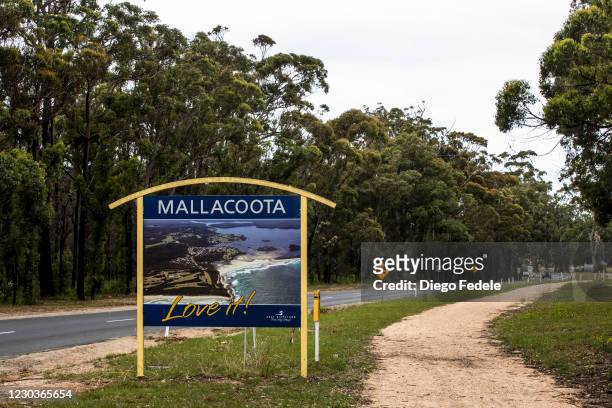 Sign marks the entry to town on December 31, 2020 in Mallacoota, Australia. New Year's Eve marks one year since bushfires swept through the township...