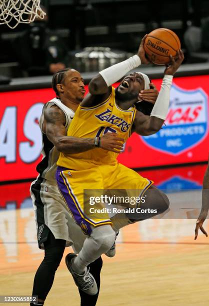 Montrezl Harrell of the Los Angeles Lakers is fouled by DeMar DeRozan of the San Antonio Spurs during second half action at AT&T Center on December...