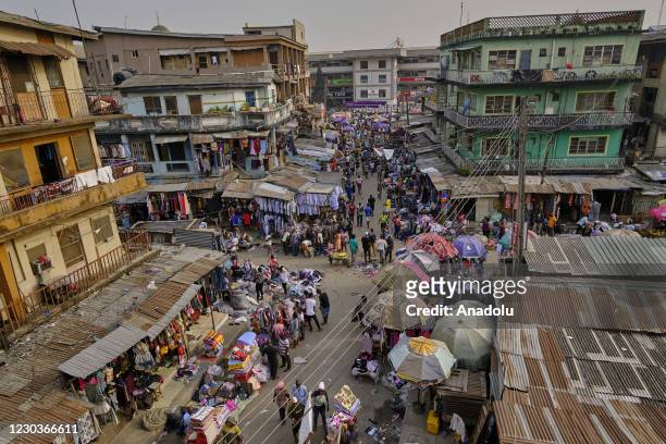 View from Nigeria's Lagos city as people continuing their daily lives in crowded area amid the novel coronavirus pandemic, on December 25, 2020....