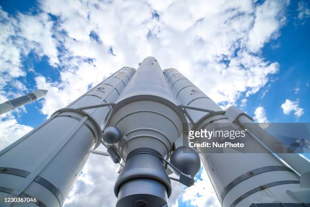 Ariane V space rocket with boosters standing. Full-scale model demonstration of Ariane 5 launcher space technology, ESA EADS Ariane space rocket in...