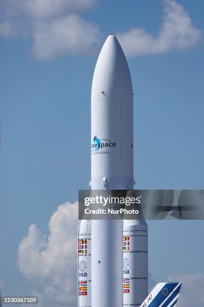 Ariane V space rocket with boosters standing. Full-scale model demonstration of Ariane 5 launcher space technology, ESA EADS Ariane space rocket in...