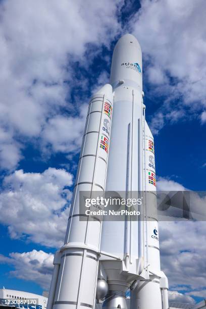 Ariane V space rocket with boosters standing. Full-scale model demonstration of Ariane 5 launcher space technology, ESA EADS Ariane space rocket in...