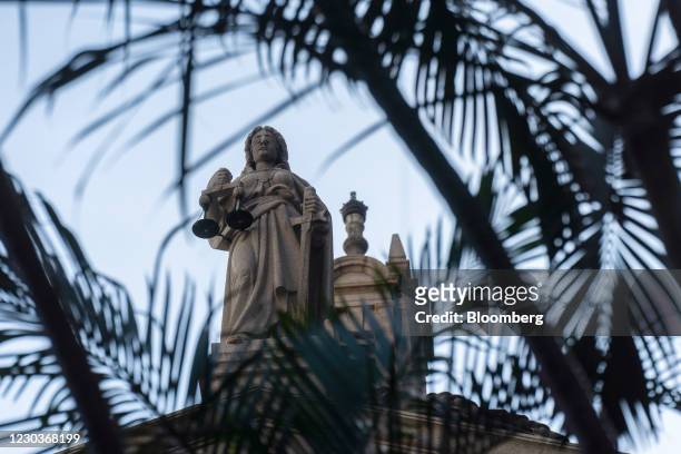 The Lady Justice statue atop the Court of Final Appeal in Hong Kong, China, on Thursday, Dec. 31, 2020. Hong Kong's courts are on the front lines of...
