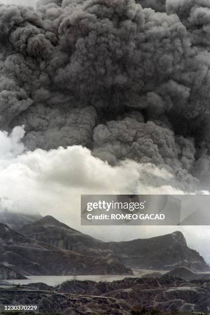 Lake of volcanic mudflow lies trapped at the slopes of Mount Pinatubo on June 28, 1991 as the volcano continues to emit clouds of steam and ash...