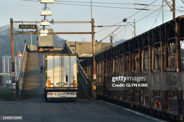 Lorries disembarks a Eurotunnel freight train on the platform at the Eurotunnel terminal at Folkestone, Southeast England, on December 31, 2020 the...