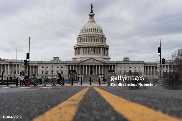 Clouds pass overt the Capitol Dome as the Senate resumes debate on overriding the veto of the National Defense Authorization Act on December 31, 2020...