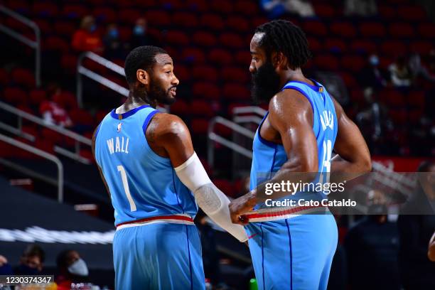 John Wall and James Harden of the Houston Rockets talk during the game against the Sacramento Kings on December 31, 2020 at the Toyota Center in...