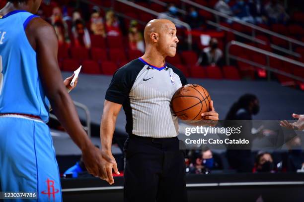 Referee Marc Davis officiates a game between the Sacramento Kings and the Houston Rockets on December 31, 2020 at the Toyota Center in Houston,...