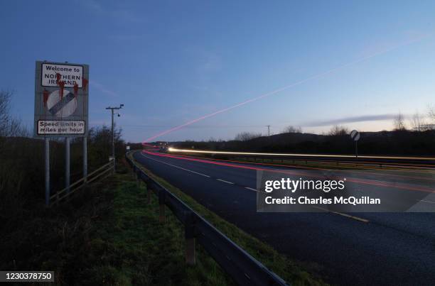 Cross border traffic enters Northern Ireland as dawn breaks on January 1, 2021 in Newry, United Kingdom. January 1st 2021 marks the first day of the...