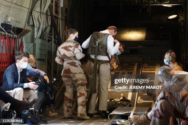French Prime Minister Jean Castex is equipped by French soldiers prior to a flight towards Faya Largeau, Chad, on December 31 after spending the New...