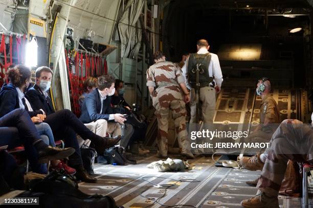 French Prime Minister Jean Castex is equipped by French soldiers prior to a flight towards Faya Largeau, Chad, on December 31 after spending the New...