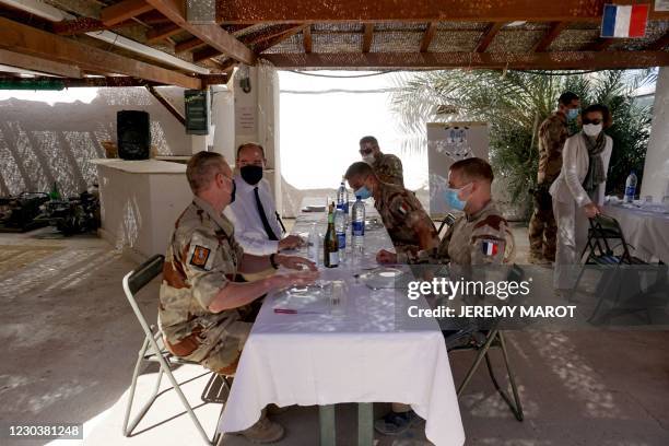French Prime Minister Jean Castex and French Defence Minister Florence Parly share a lunch with French soldiers in Faya Largeau, Chad, on December 31...