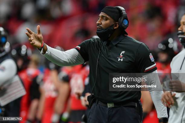 Cincinnati defensive coach Greg Scruggs gestures on the sideline during the Chick-fil-A Peach Bowl between the Cincinnati Bearcats and the Georgia...