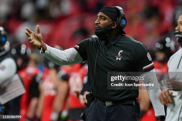 Cincinnati defensive coach Greg Scruggs gestures on the sideline during the Chick-fil-A Peach Bowl between the Cincinnati Bearcats and the Georgia...