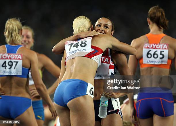 Tatyana Chernova of Russia and Jessica Ennis of Great Britain congratulate each other after 800 metres in the women's heptathlon during day four of...