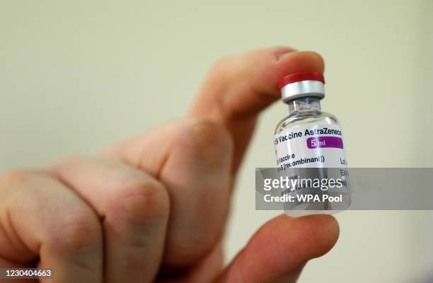 Vial of doses of the Oxford University/AstraZeneca Covid-19 vaccine is checked, as the first batch arrives at the Princess Royal Hospital in Haywards...