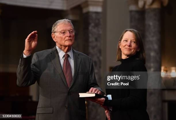 Sen. Jim Inhofe participates in a mock swearing-in for the 117th Congress with Vice President Mike Pence, as his wife Kay Inhofe holds a bible, in...