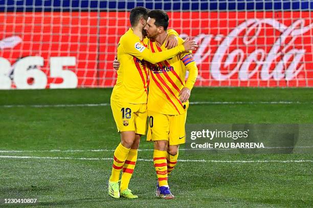 Barcelona's Spanish defender Jordi Alba hugs Barcelona's Argentinian forward Lionel Messi as they celebrate their team's goal during the Spanish...