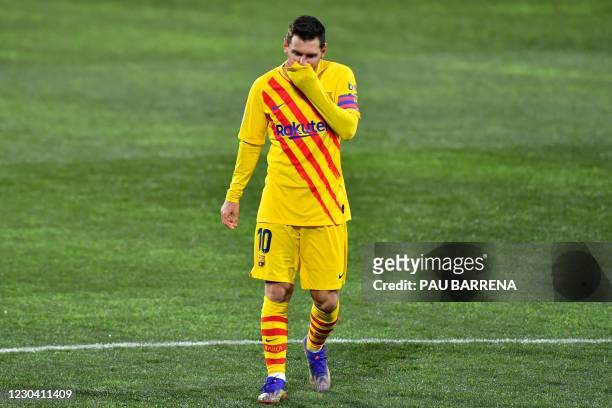 Barcelona's Argentinian forward Lionel Messi reacts during the Spanish League football match between Huesca and Barcelona at the El Alcoraz stadium...