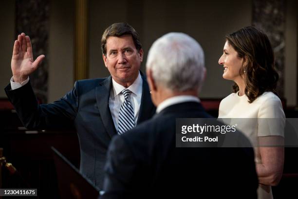 Vice President Mike Pence administers the Senate oath of office to Bill Hagerty as his wife Chrissy, holds the bible, during a mock swearing-in...