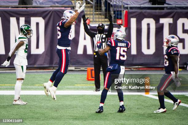 Devin Asiasi celebrates with teammate NKeal Harry of the New England Patriots after scoring a touchdown against the New York Jets in the second half...