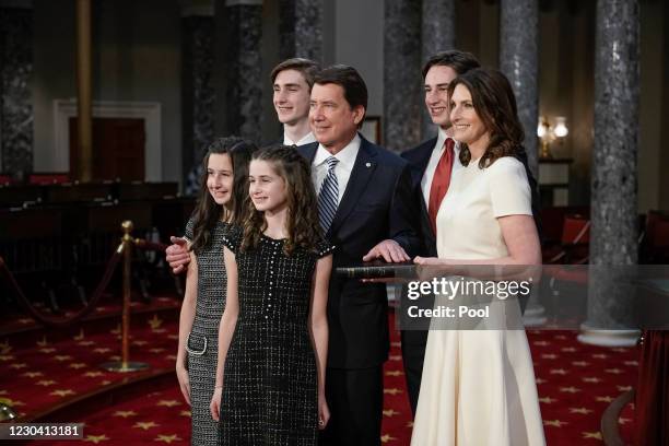 Sen. Bill Hagerty is joined by his wife Chrissy Hagerty and their children after he took the oath of office from Vice President Mike Pence during a...