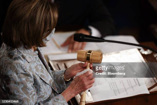 House Speaker Nancy Pelosi, a Democrat from California, sanitizes the Speaker's gavel during the first session of the 117th Congress in the House...