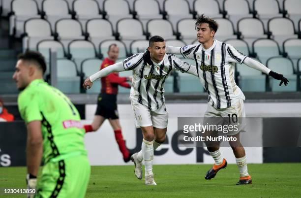 Cristiano Ronaldo of Juventus celebrates with teammates Paulo Dybala after scoring their team's first goal during during the Serie A match between...
