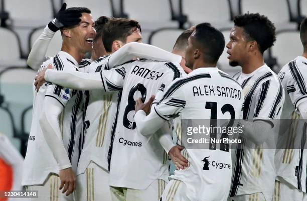 Cristiano Ronaldo of Juventus celebrates with teammates Aaron Ramsey, Weston McKennie and Alex Sandro after scoring their team's first goal during...