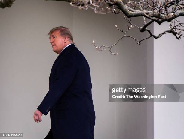 December 31: President Donald Trump walks to the Oval Office after he and First Lady Melania Trump arrive on the South Lawn of the White House after...