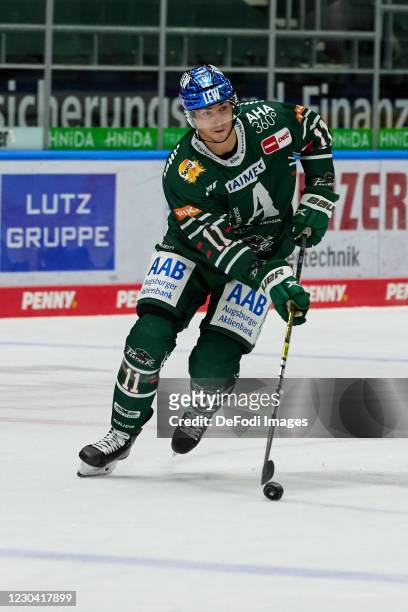 Adam Payerl of Augsburg Pather controls the Puck during the DEL match between Augsburger Panther and Ice Tigers Nuernberg on January 3, 2021 in...