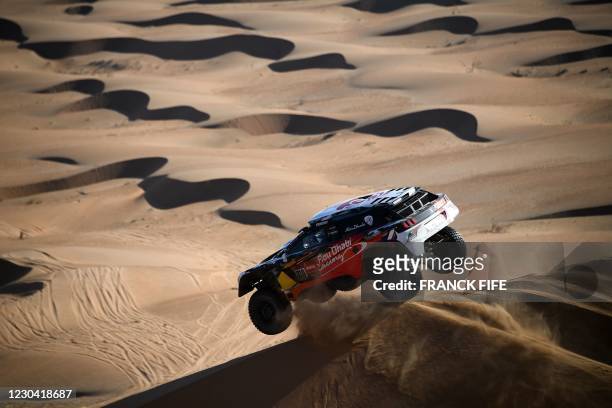 Peugeot's driver Khalid Sheikh al-Qassimi of Saudi Arabia and co-driver French Xavier Panseri compete during Stage 2 of the Dakar Rally 2021 between...