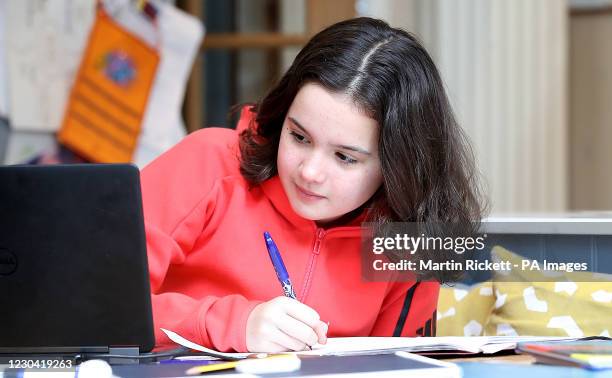 Sophie Symes, a year 7 pupil at Knutsford Academy in Cheshire, studies at home as many schools switch to online learning.