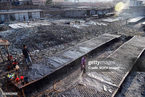 Labourers working at a tannery factory in Hazaribagh. The Leather industry is a major industry in Bangladesh and the Government of Bangladesh has...