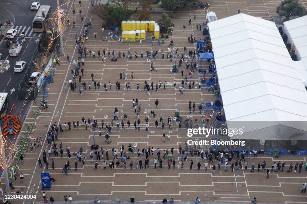 People queue outside a Covid-19 mass vaccination center at Rabin Sqaure in this aerial photograph taken in Tel Aviv, Israel, on Monday, Jan. 4, 2020....