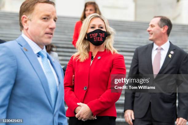 Rep. Marjorie Taylor Green, R-Ga., is seen during a group photo with freshmen members of the House Republican Conference on the House steps of the...