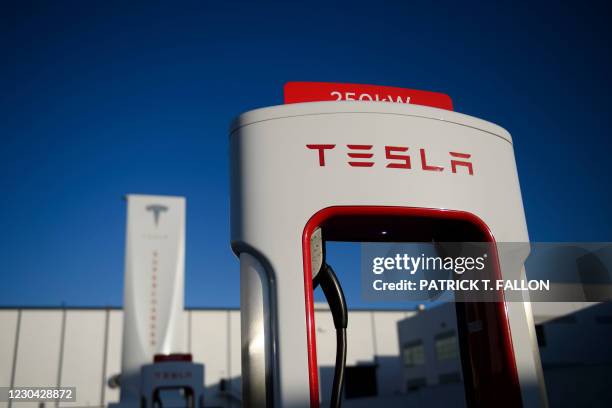 Tesla logo is seen on a 250kW electric vehicle charging station at the Tesla Inc. Supercharger station on January 4, 2021 in Hawthorne, California. -...