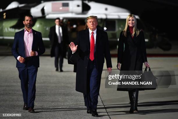 President Donald Trump , daughter Senior Advisor Ivanka Trump and son Donald Trump Jr. Make their way to board Air Force One before departing from...