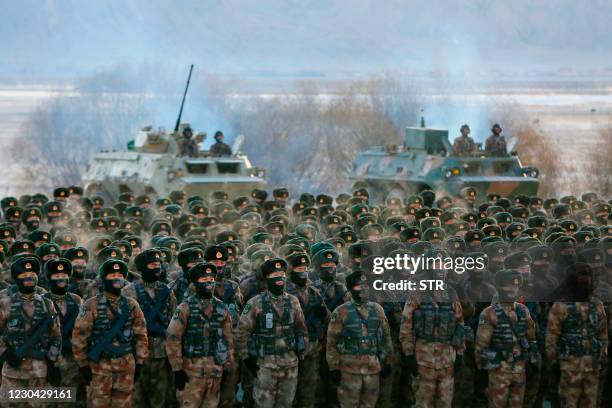 This photo taken on January 4, 2021 shows Chinese People's Liberation Army soldiers assembling during military training at Pamir Mountains in...