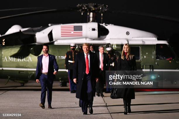 President Donald Trump , daughter Senior Advisor Ivanka Trump and son Donald Trump Jr. Make their way to board Air Force One before departing from...