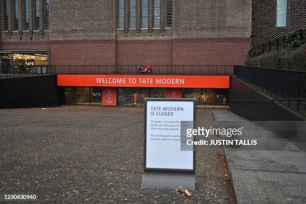 Sign outside the Tate Modern museum notifies potential visitors that the museum is closed as Britain enters a national lockdown in London on January...