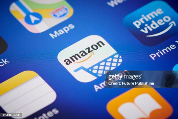 Close-up detail of the Amazon app icon on an Apple iPhone 12 Pro smartphone screen, on November 11, 2020.