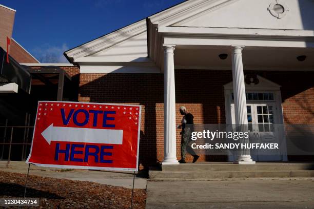 Voters enter a polling station at the Zion Baptist Church on January 5, 2021 in Marietta, Georgia. After an unprecedented campaign that mobilized...