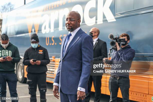 Georgia Senatorial candidate Reverend Raphael Warnock speaks to supporters at a canvassing event on January 5, 2021 in Marietta, Georgia. - Voters...