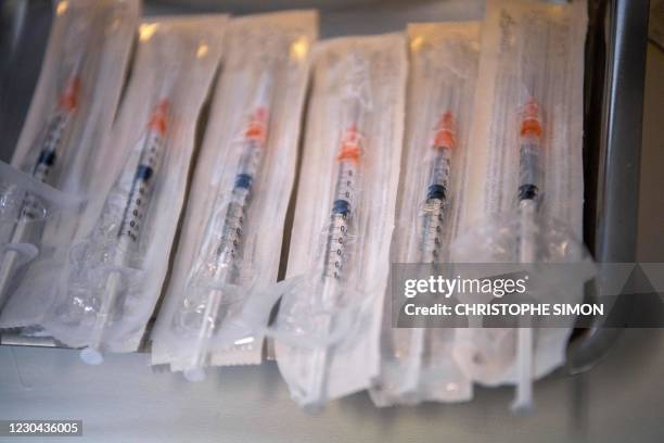 Picture shows syringes prepared to administer the Pfizer-BioNTech Covid-19 vaccine at the Timone Hospital in Marseille, southeastern France, on...