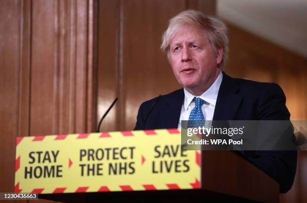 Britain's Prime Minister, Boris Johnson attends a news conference in response to the ongoing situation with the coronavirus disease pandemic, inside...