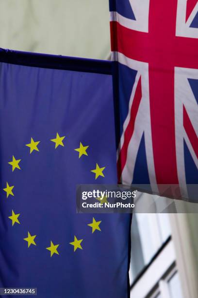 European Union and Great Britain flags are seen on the building in Krakow, Poland on January 5, 2020.